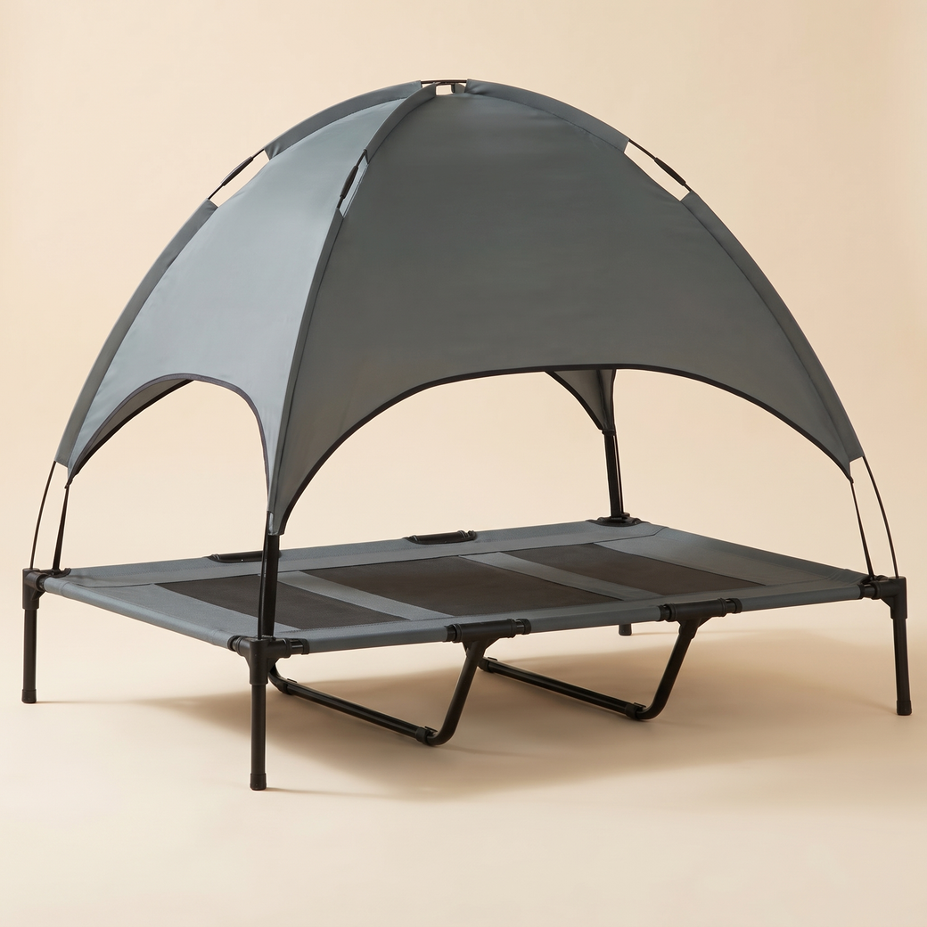 elevated dog cot with UV-protective canopy shade — studio product photo
